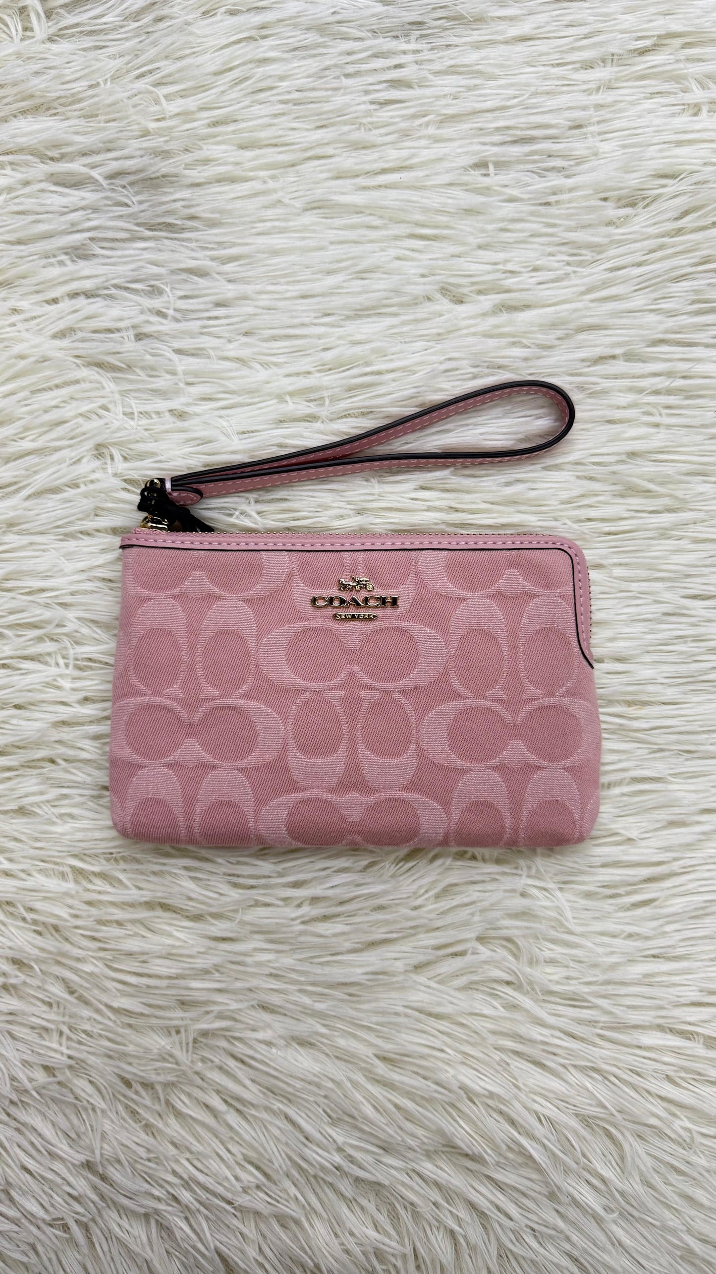 Muñequera rosa Coach