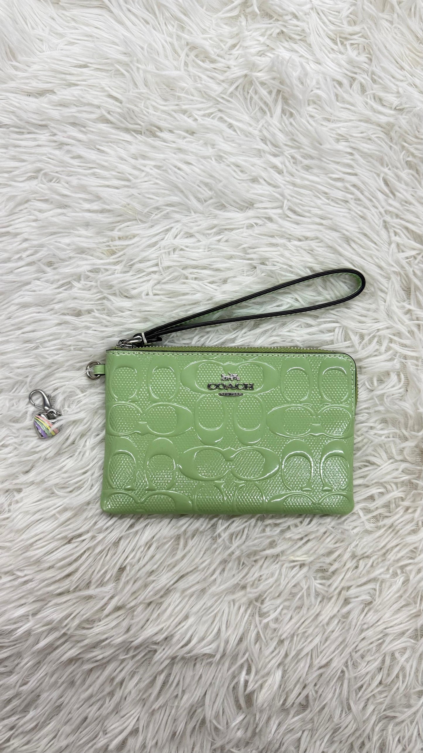 Muñequera verde Coach