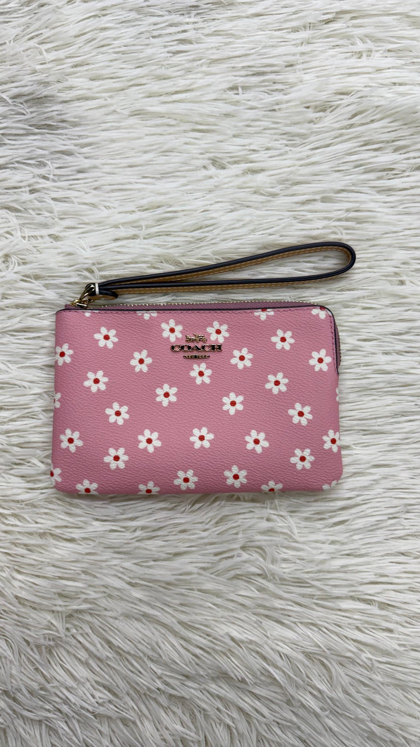 Muñequera rosa Coach
