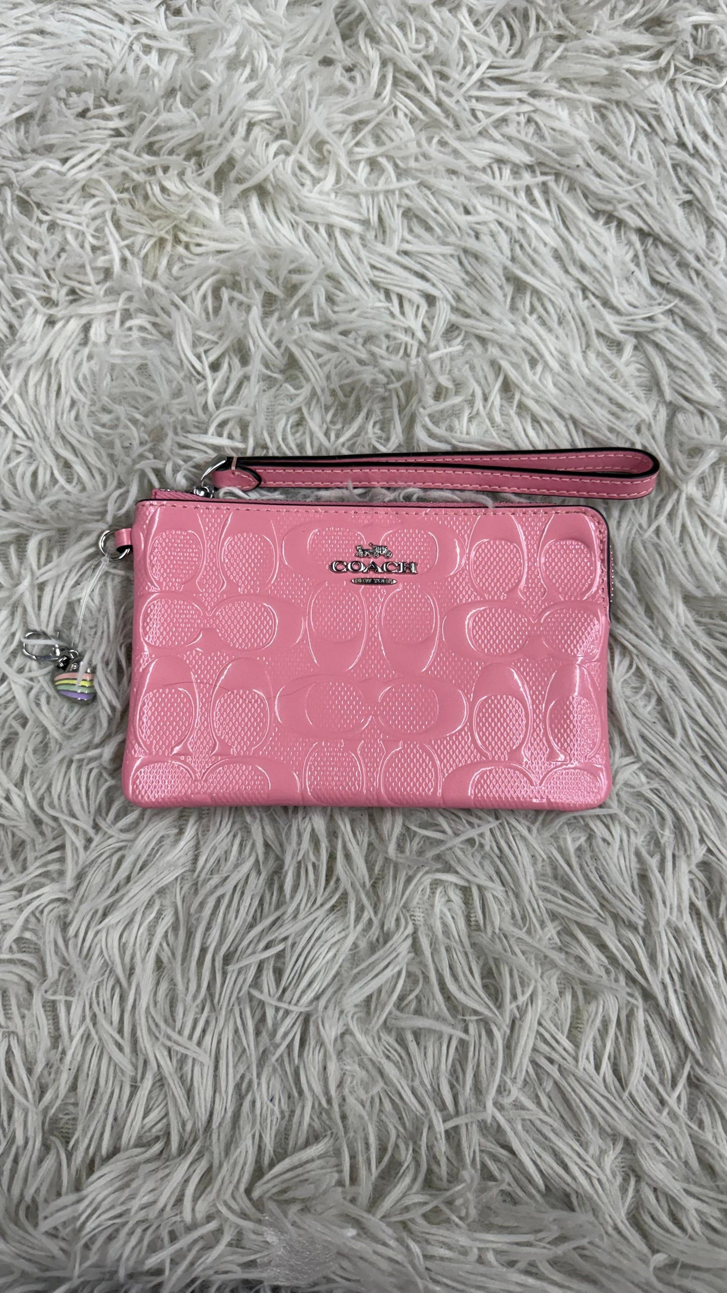Muñequera rosa Coach