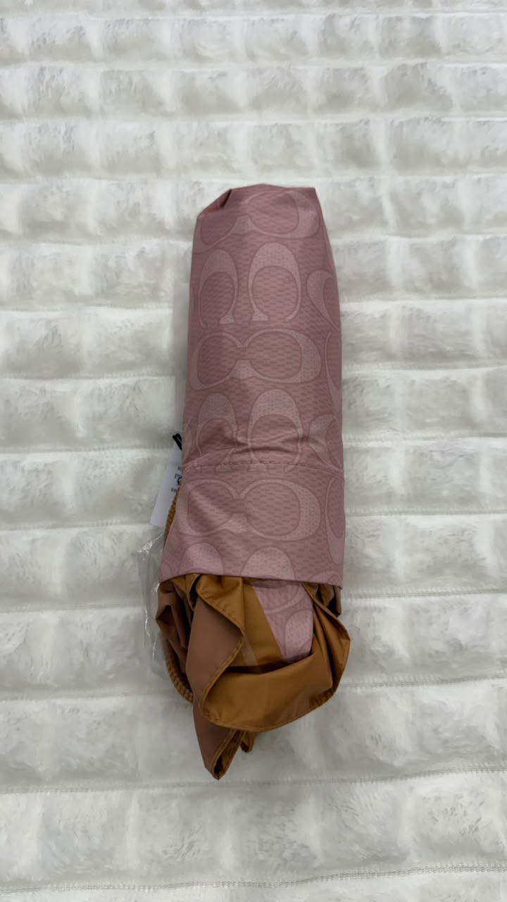Sombrilla rosa Coach