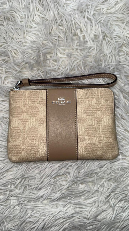 Muñequera crema Coach