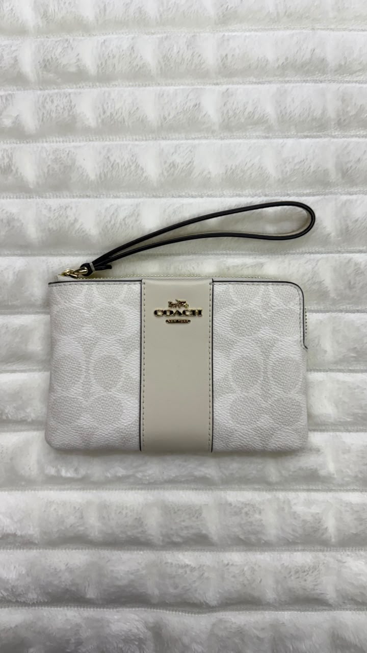 Muñequera blanca Coach