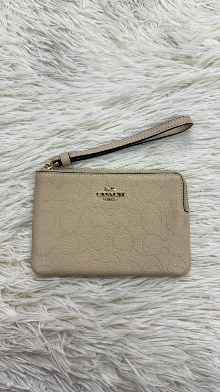 Muñequera beige Coach