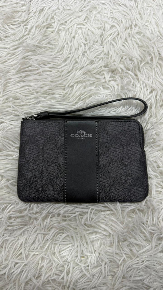 Muñequera negra Coach