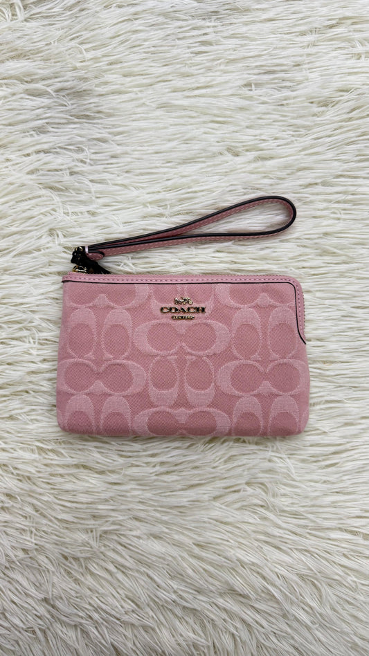 Muñequera rosa Coach