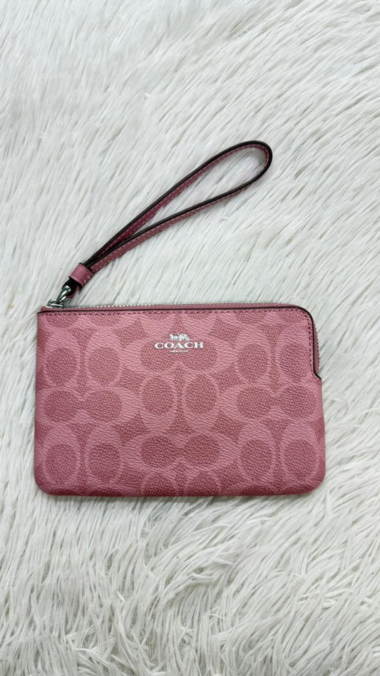 Muñequera rosa Coach