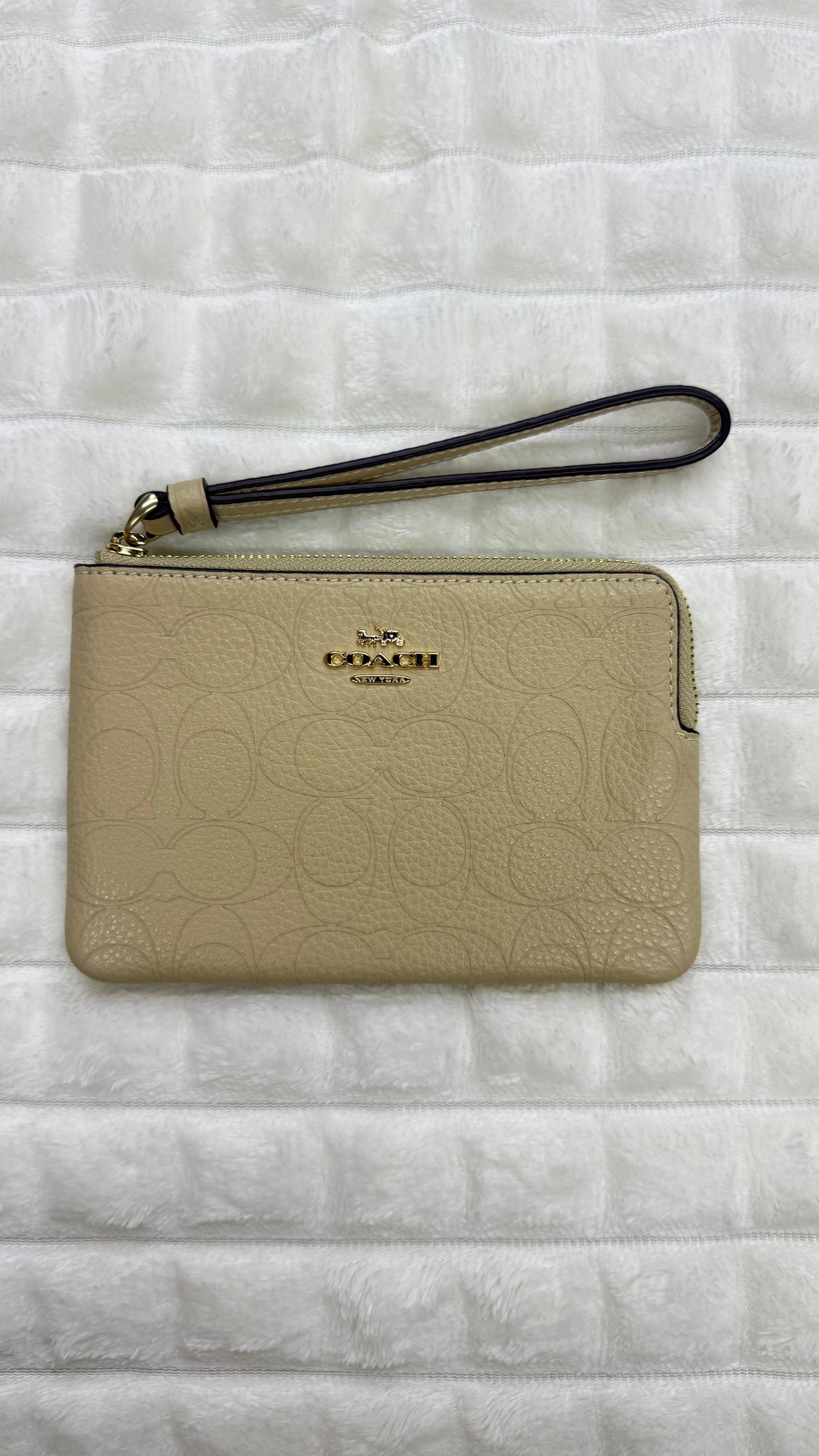 Muñequera beige Coach
