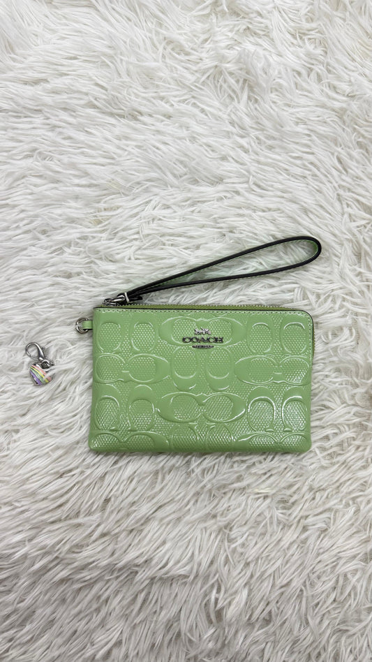 Muñequera verde Coach