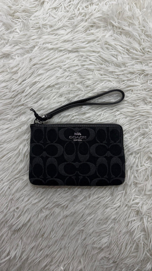 Muñequera negra Coach