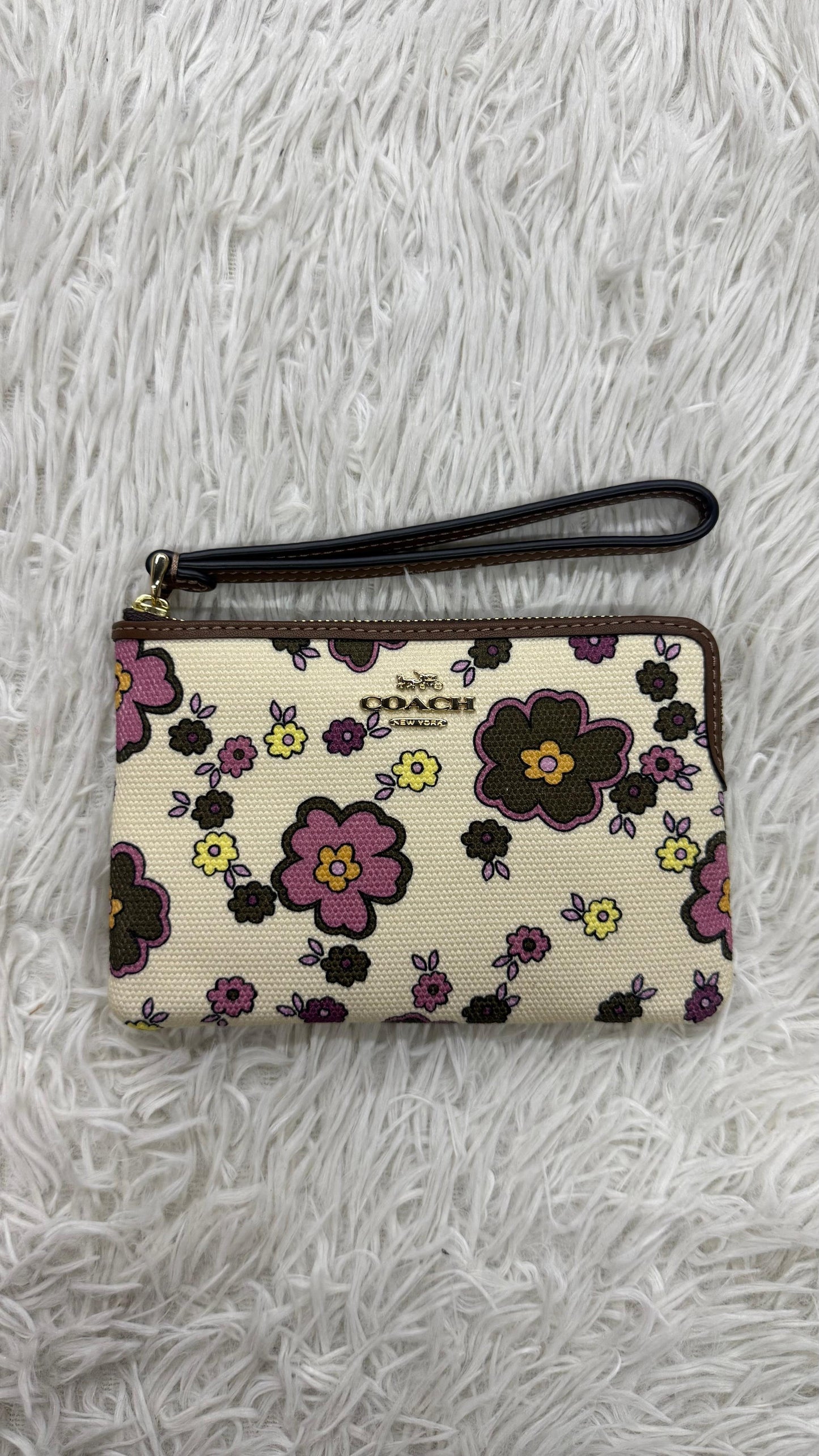 Muñequera flores Coach