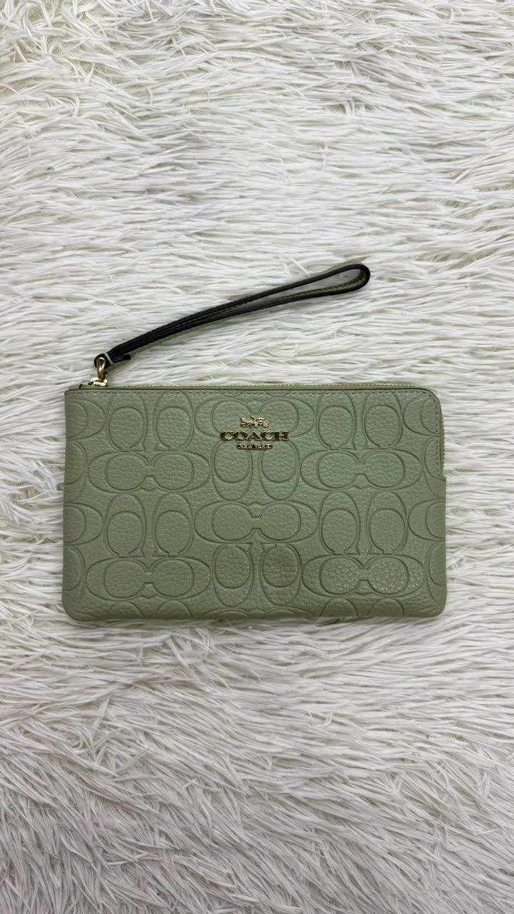 Muñequera verde Coach