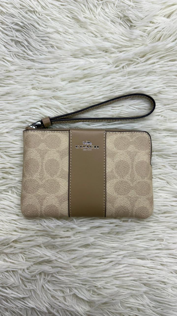 Muñequera beige Coach