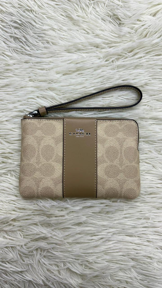 Muñequera beige Coach