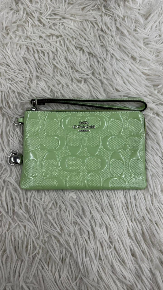 Muñequera verde Coach