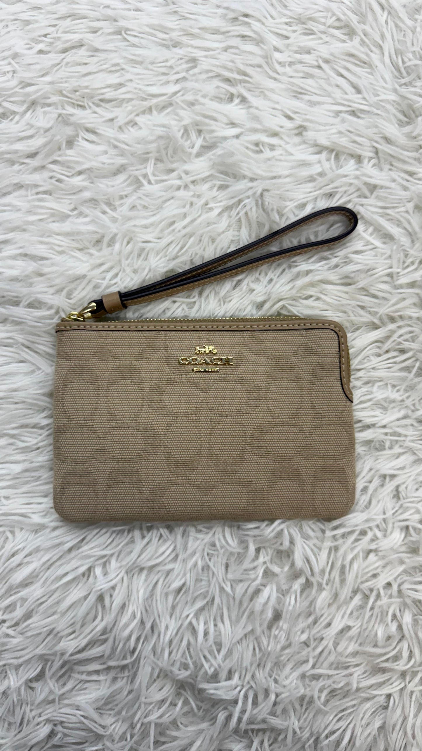 Muñequera beige Coach