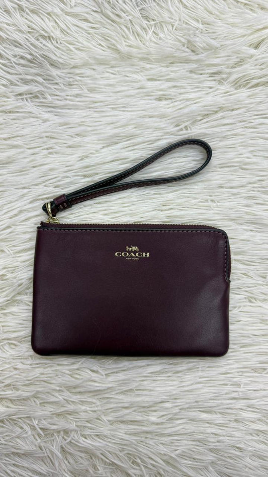 Muñequera vino Coach