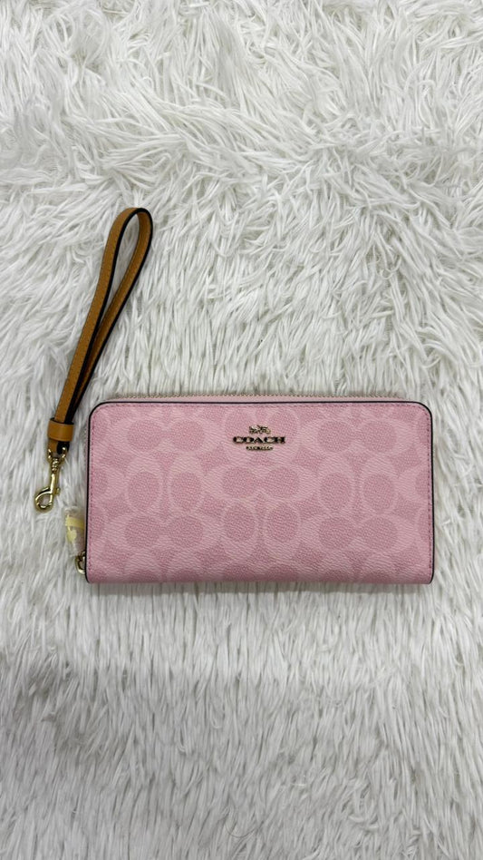 Muñequera rosa Coach